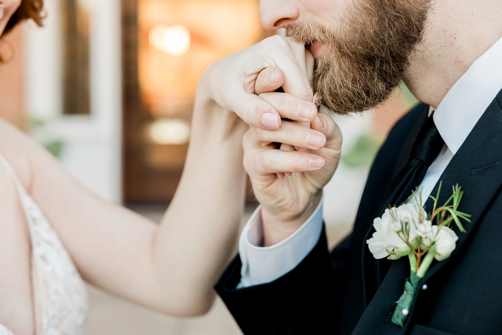 Groom Kissing Bride's Hand